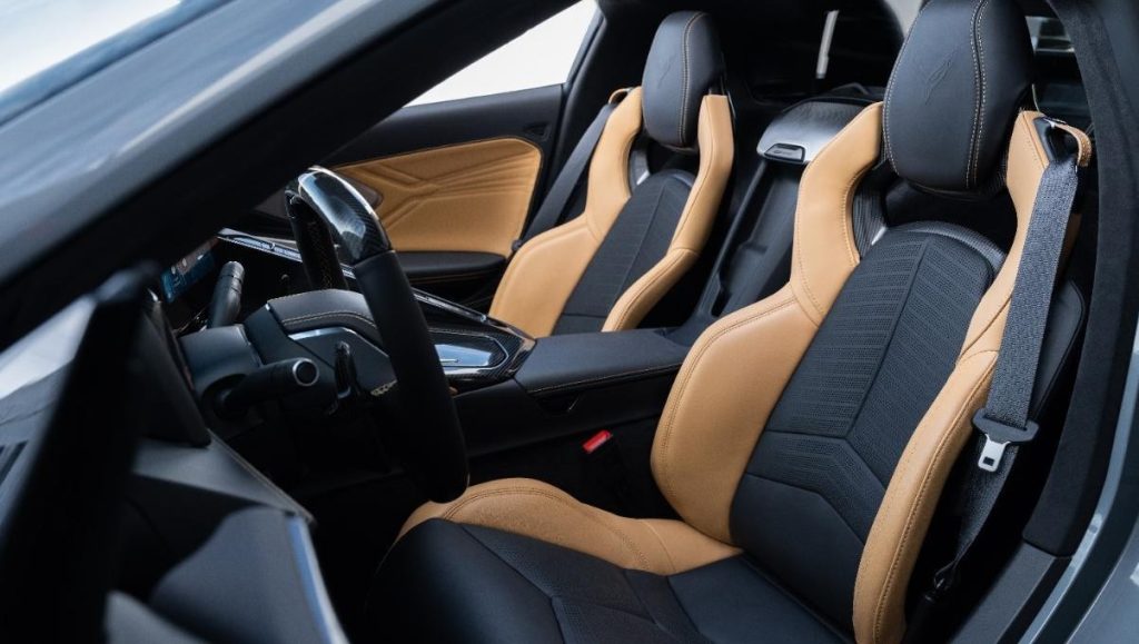 Driver side 3/4 view of 2024 Chevrolet Corvette E-Ray 3LZ convertible with Natural Tan Interior. Pre-production model shown. Actual production model may vary. Model year 2024 Corvette E-Ray available 2023.