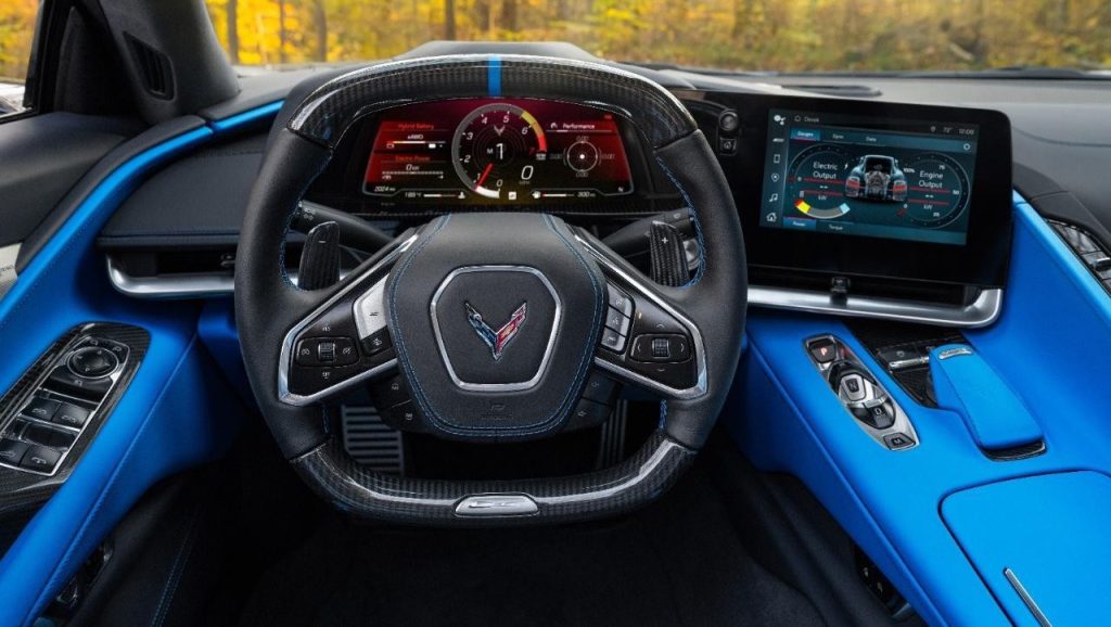 View from driver’s seat in 2024 Chevrolet Corvette E-Ray 3LZ coupe in Silver Flare with Two Tone Blue Interior. Pre-production model shown. Actual production model may vary. Model year 2024 Corvette E-Ray available 2023.