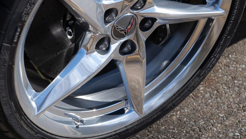 Close up view of aluminum wheel with Pearl Nickel finish on 2024 Chevrolet Corvette E-Ray 3LZ. Pre-production model shown. Actual production model may vary. Model year 2024 Corvette E-Ray available 2023.