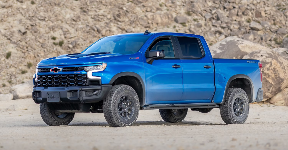 2025 Chevy Silverado 1500 in Blue parked in front of a dirt hill